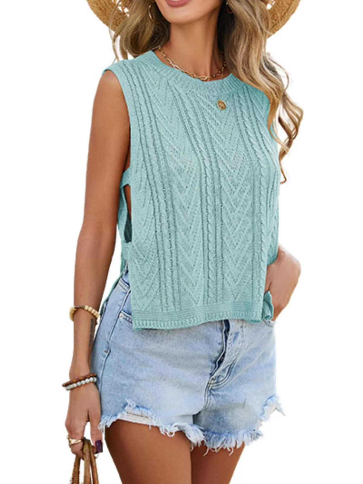Cable knit round neck sweater vest layered over shirt