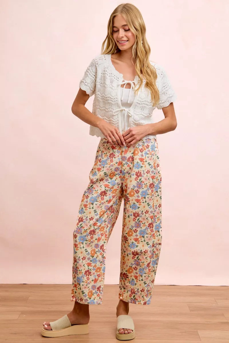 Seated view of the floral cotton barrel pants