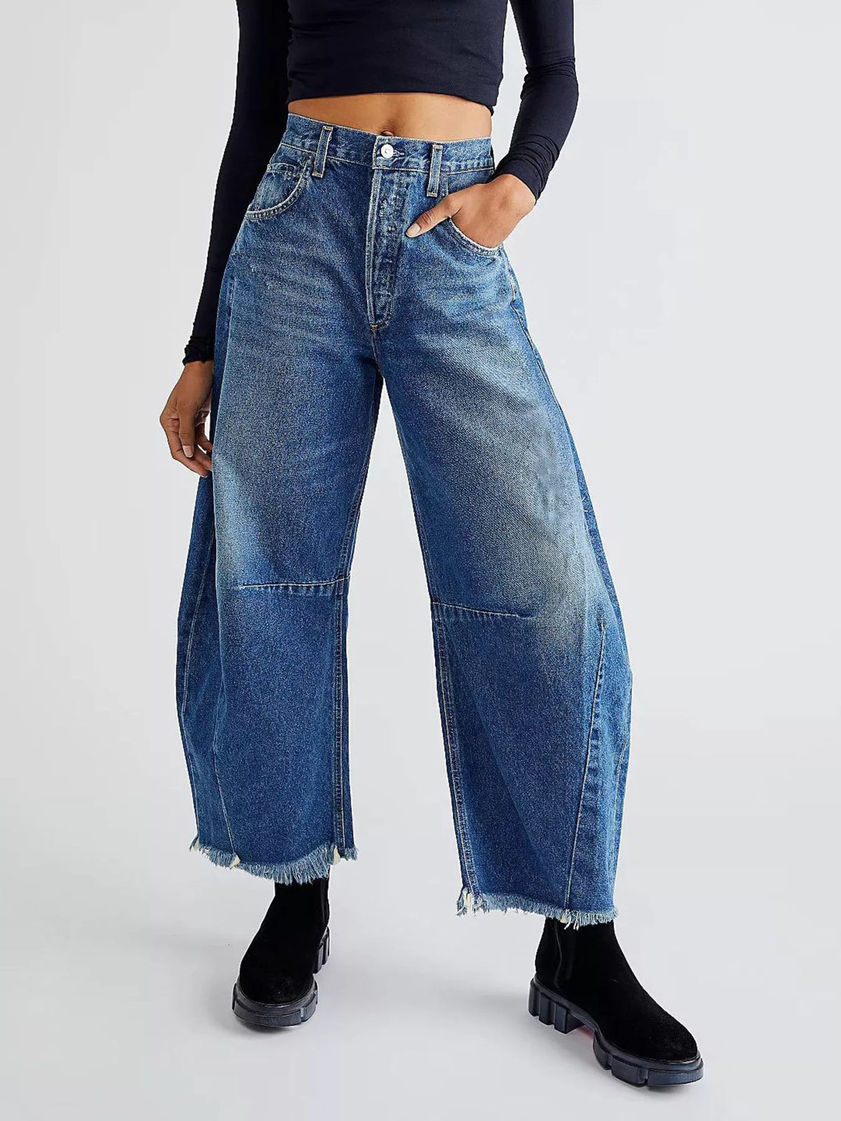 Wide leg raw hem blue jeans front view