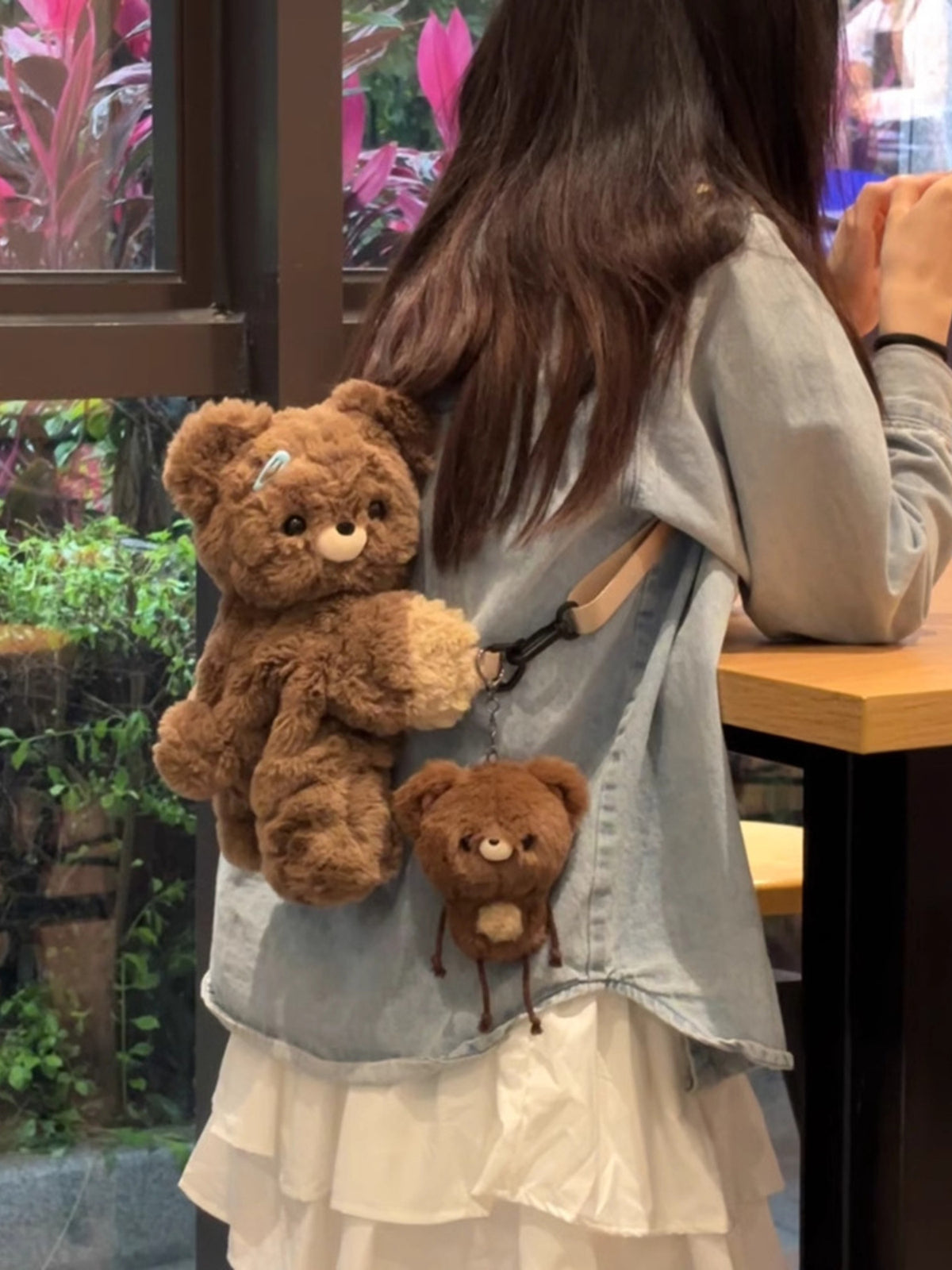 Dark brown plush teddy bear backpack back and straps