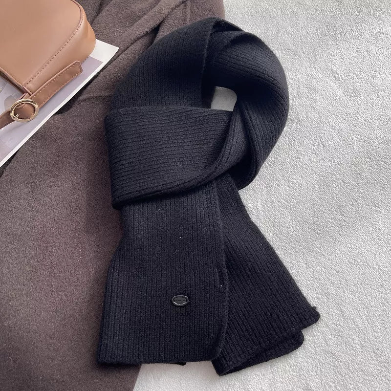 Wool knit scarf styled with a tailored coat