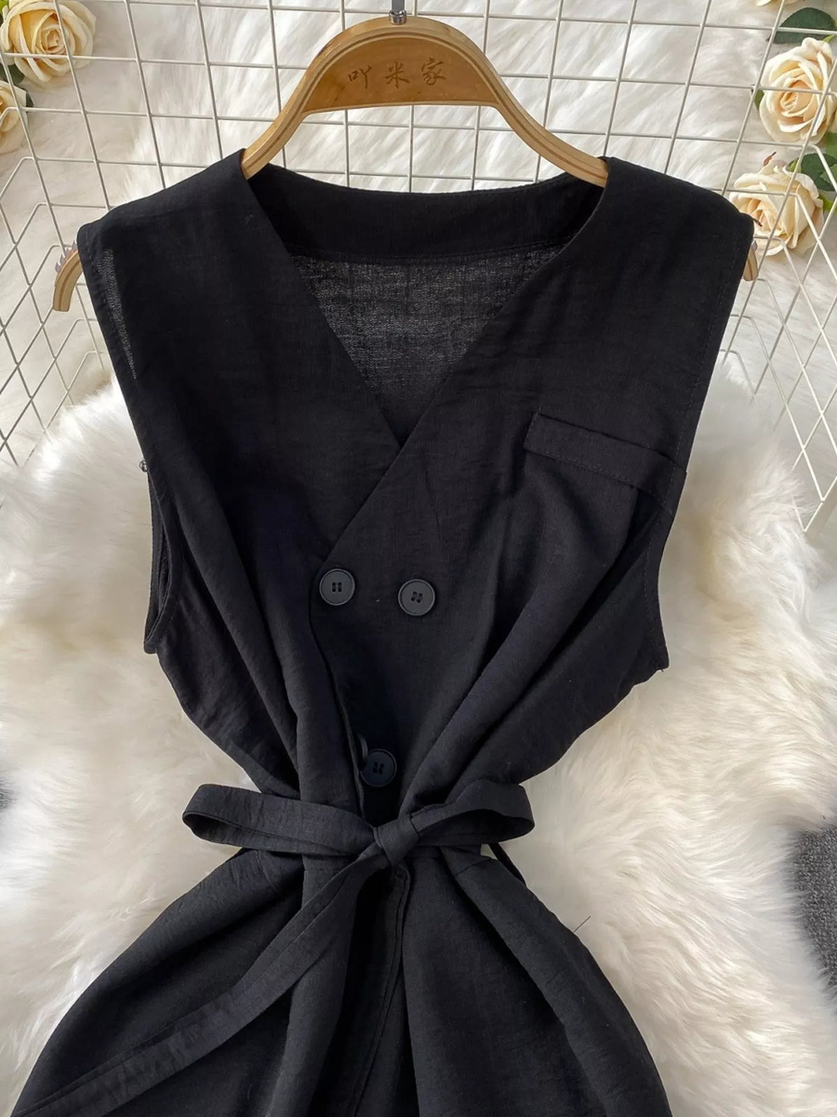 Sleeveless wide leg jumpsuit belt detail