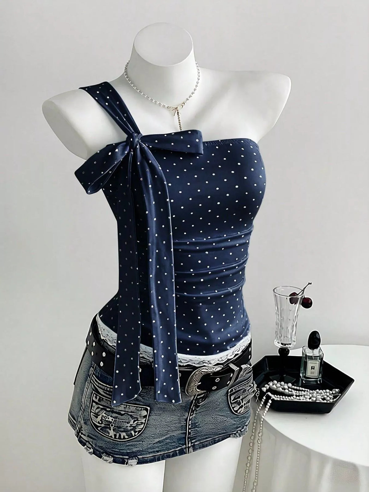 Cropped cami styled with a high waisted trouser