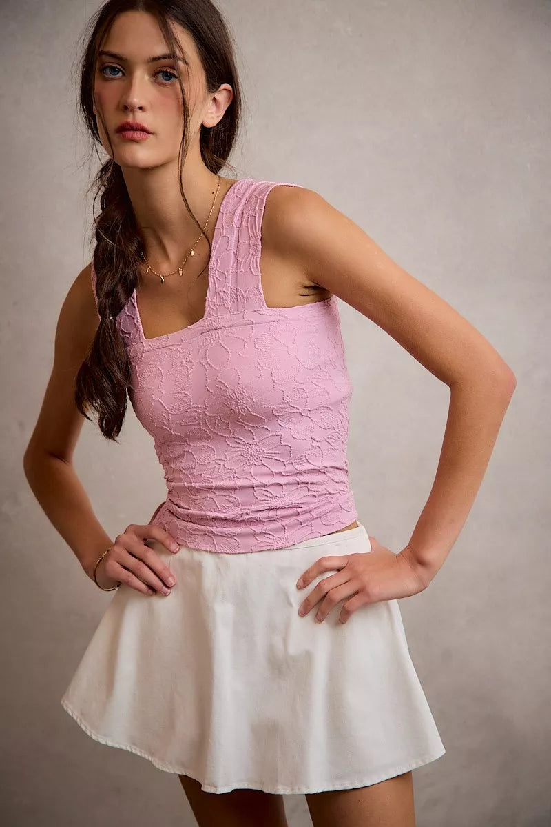 White denim bubble skort with smocked back waist close up view