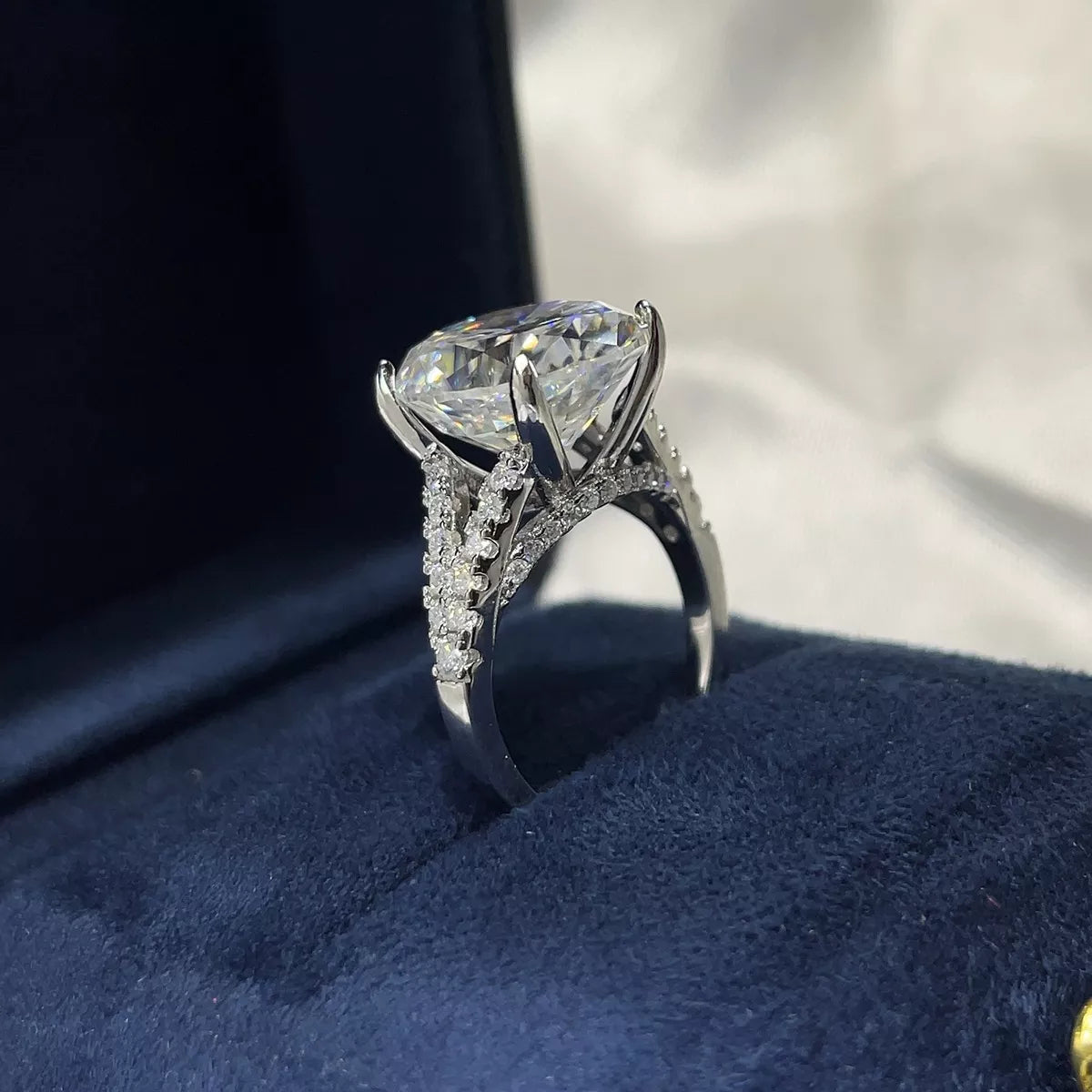 Moissanite ring worn on a hand to show scale