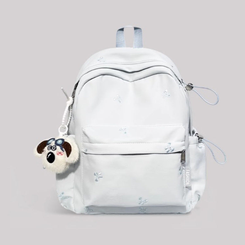 Light blue embroidered nylon backpack front view