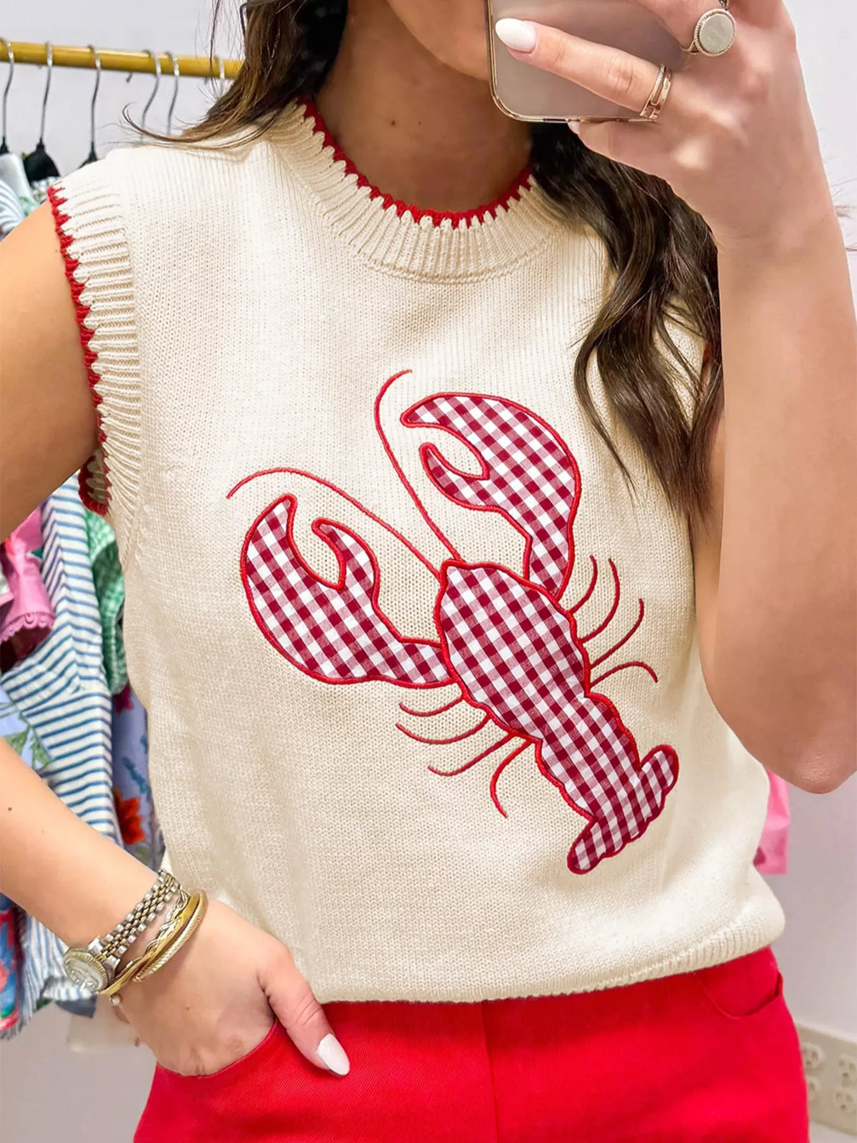 Lobster embroidery detail on knit vest