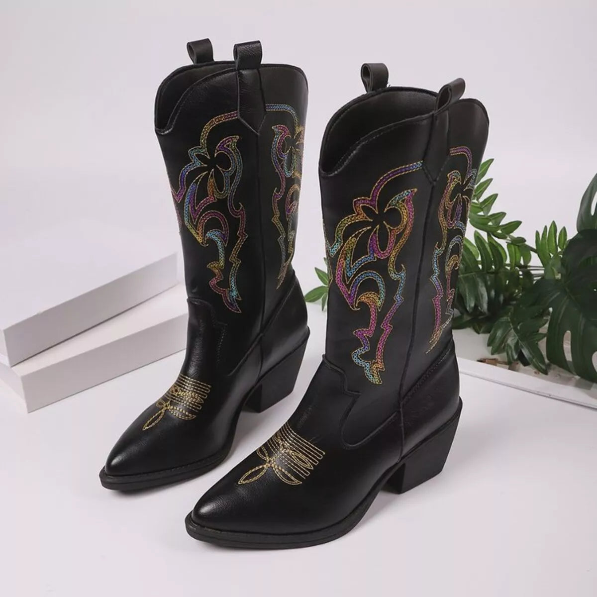 Point toe block heel ankle boots toe close up