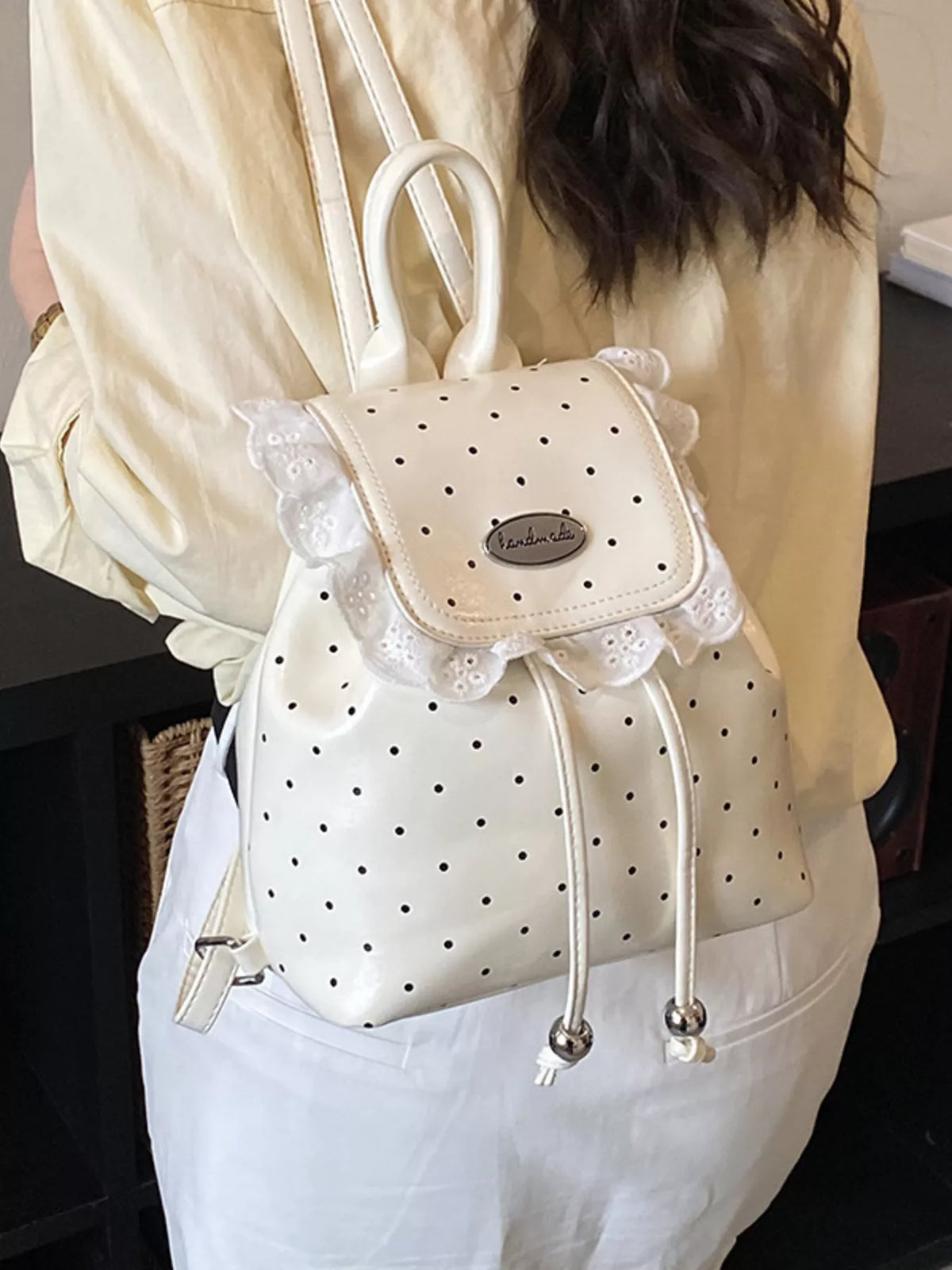 Cream polka dot mini backpack front view