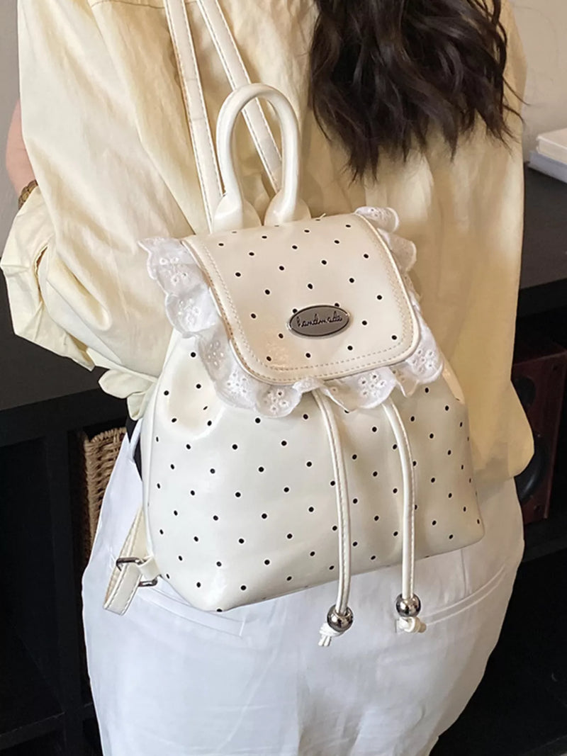 Cream polka dot mini backpack front view