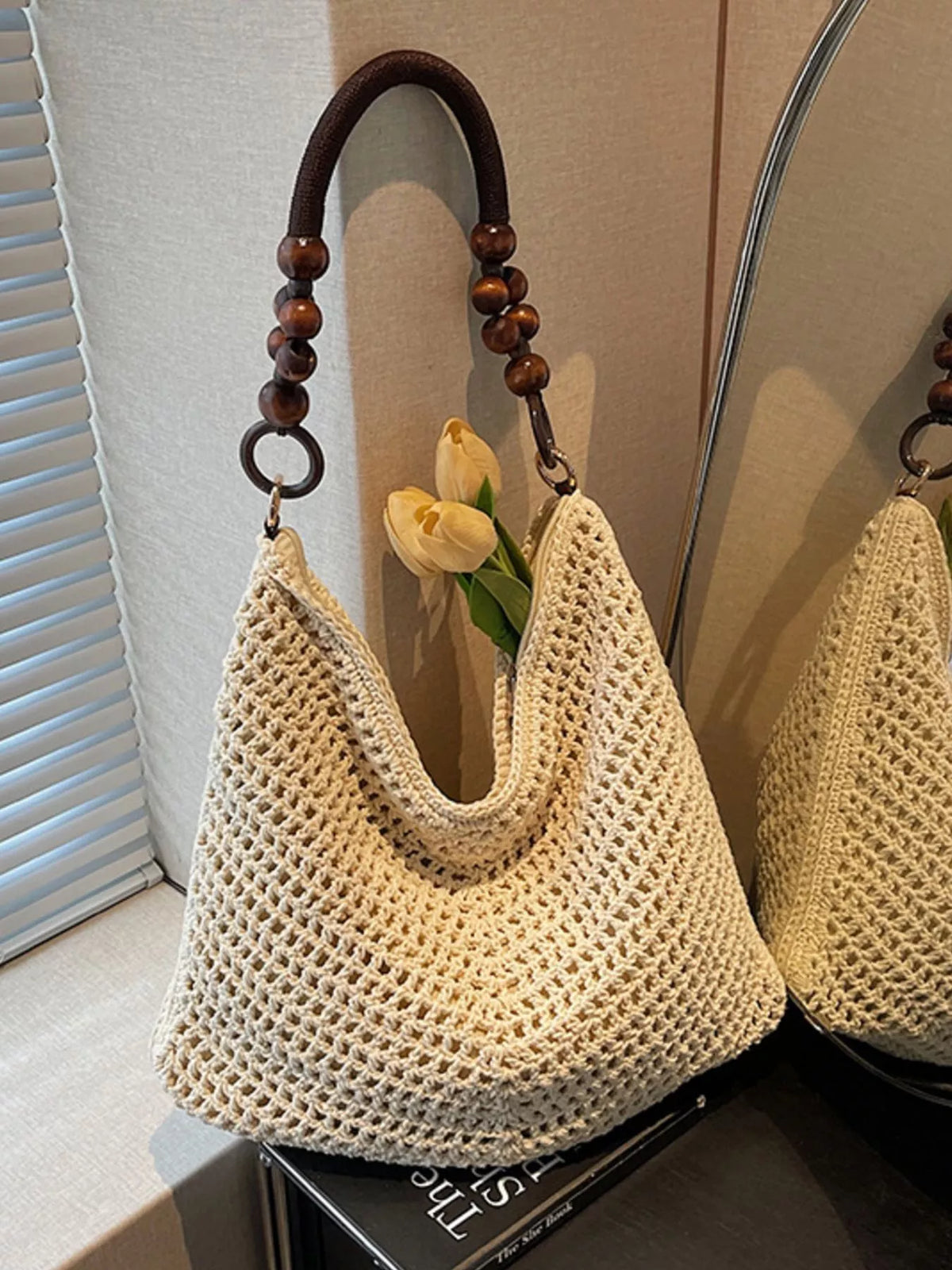 Ivory knitted shoulder bag with wooden bead handle front view