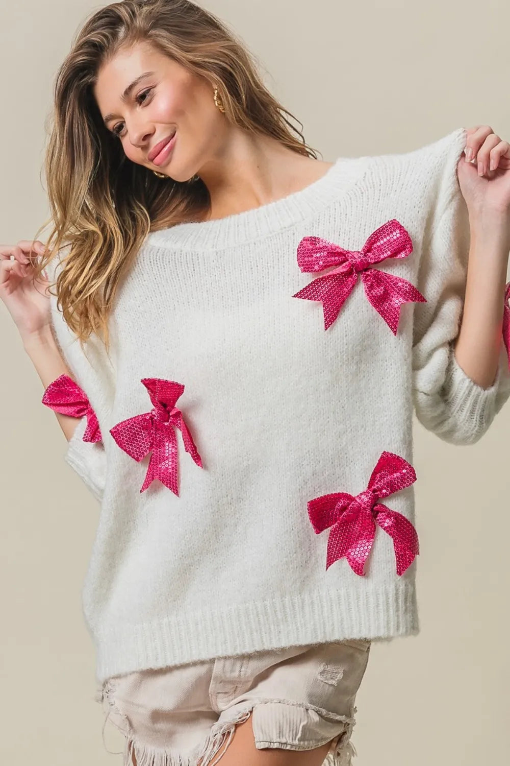 Bow detail sequin sweater side view