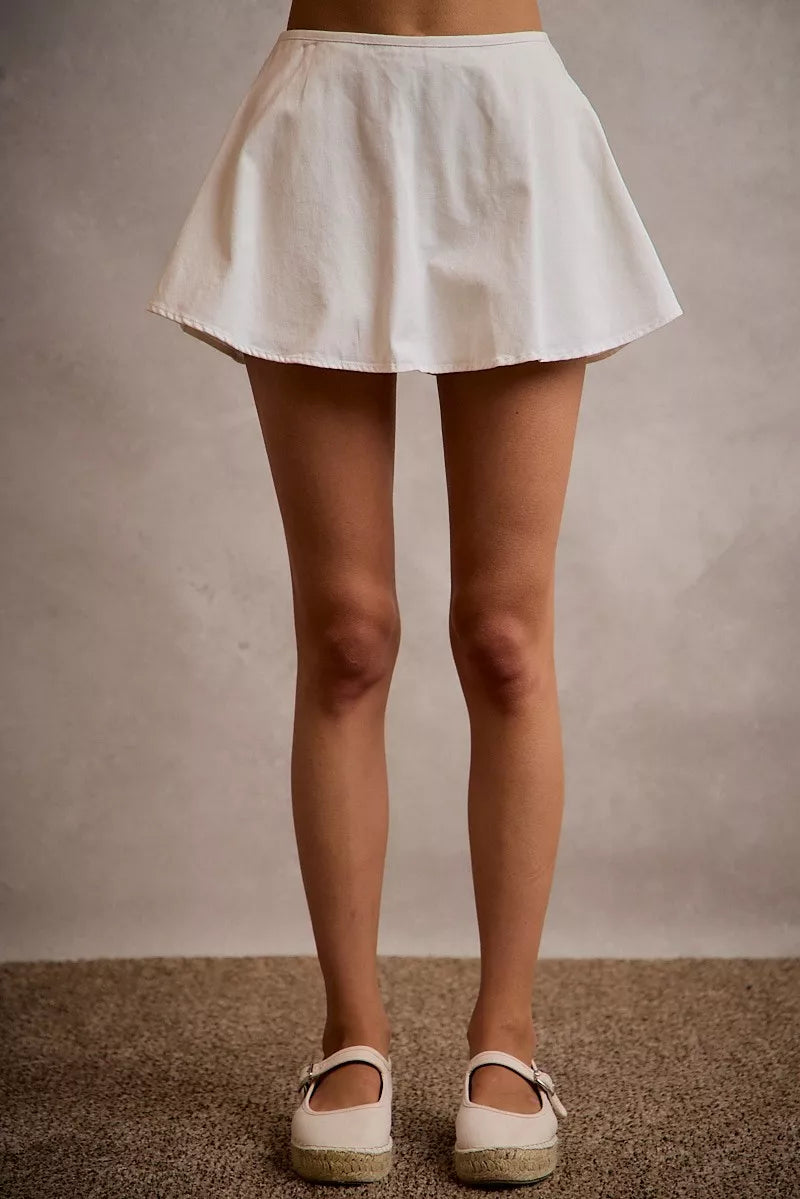 White denim bubble skort with smocked back waist front view