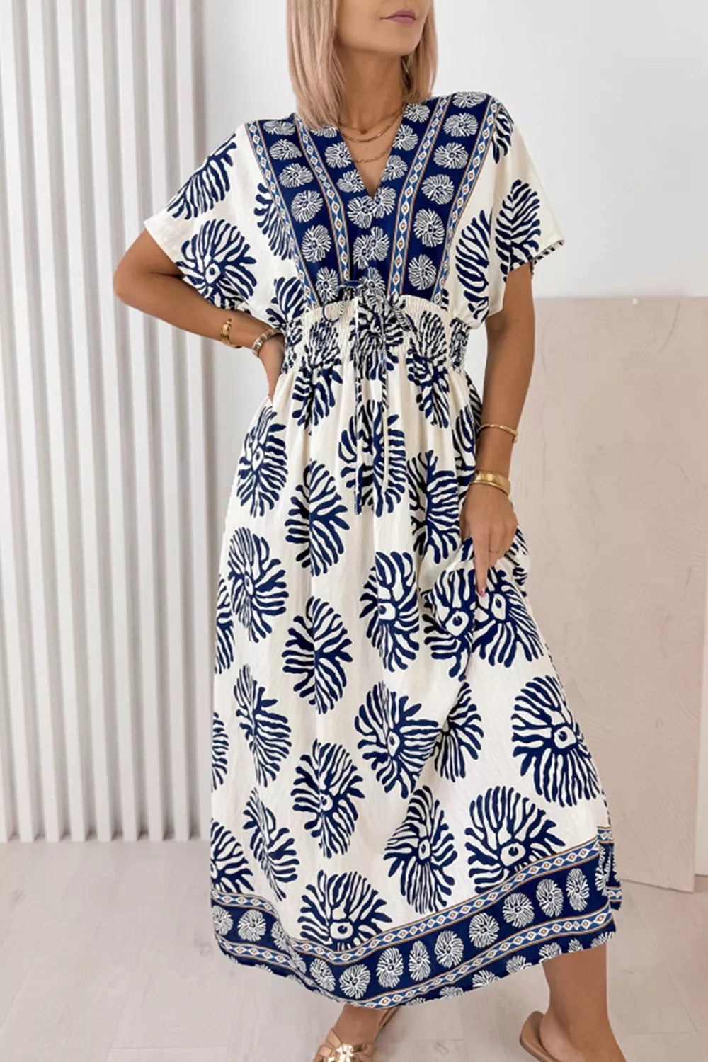 Floral patchwork dolman dress in dusty blue front view