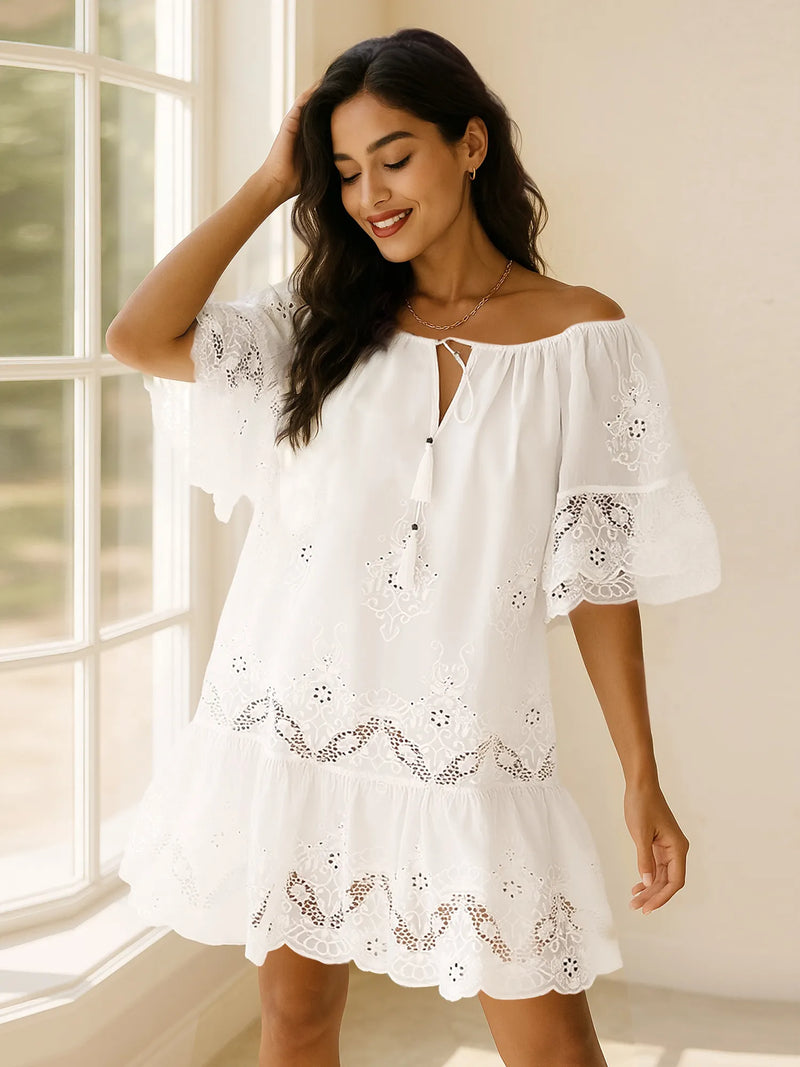 White eyelet embroidered tassel tie neck dress front view