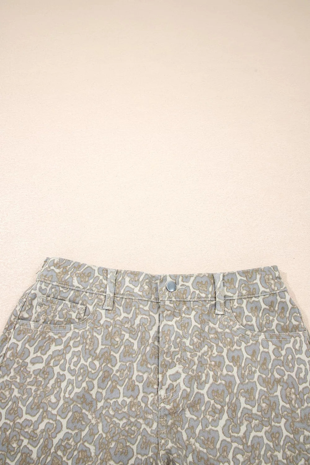 Khaki leopard print raw edge denim shorts close up detail
