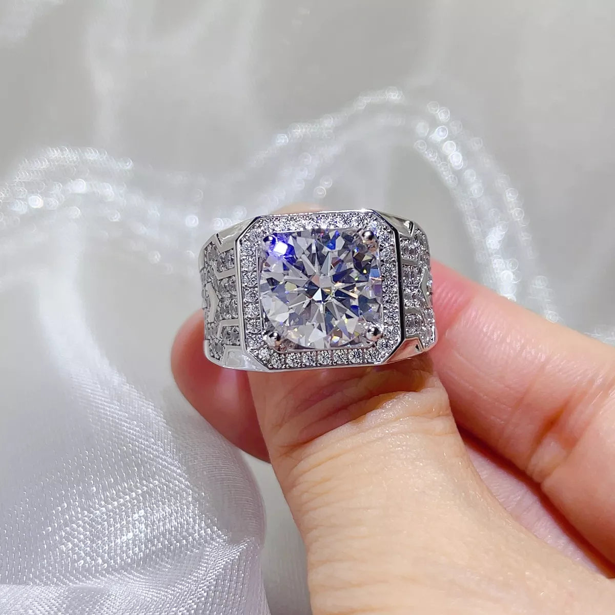 Moissanite ring shown on a hand from the front