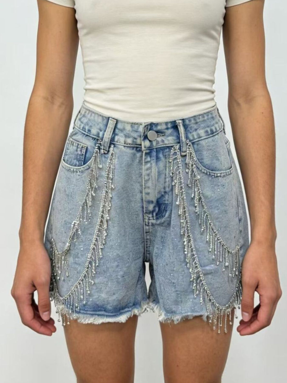 Denim shorts with rhinestone chain detail, front view