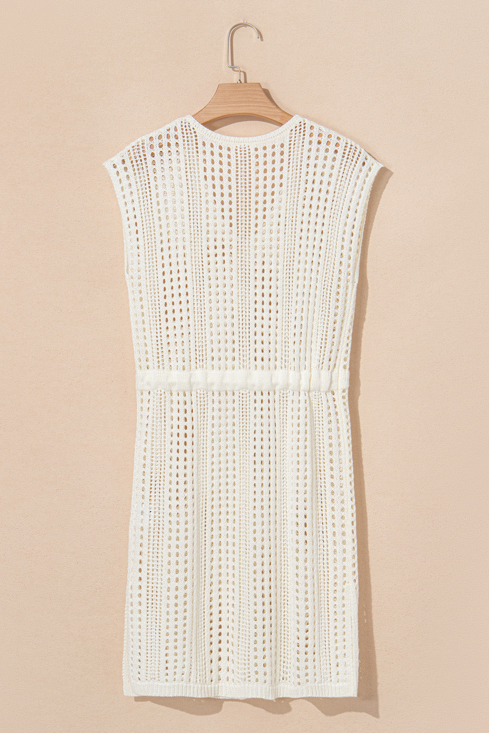 Drawstring waist detail on beige knit cover up