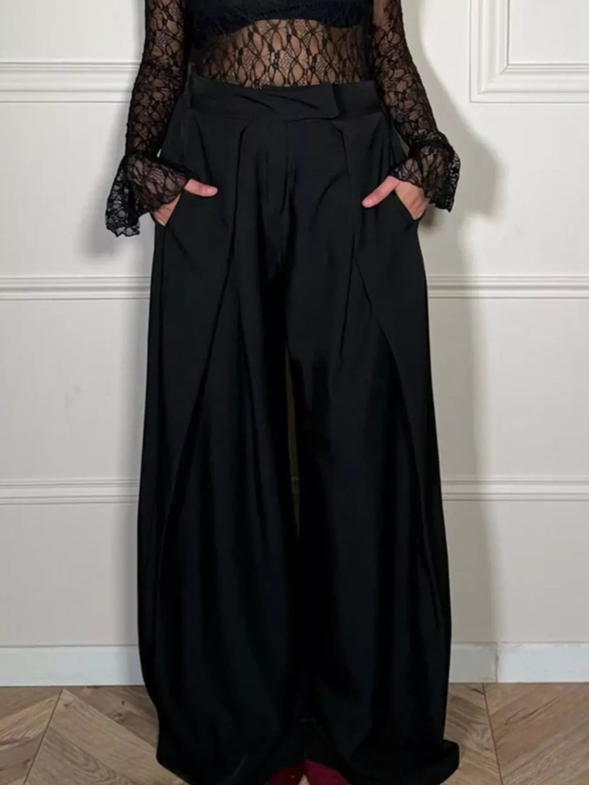 Black high waisted wide leg pants on a model