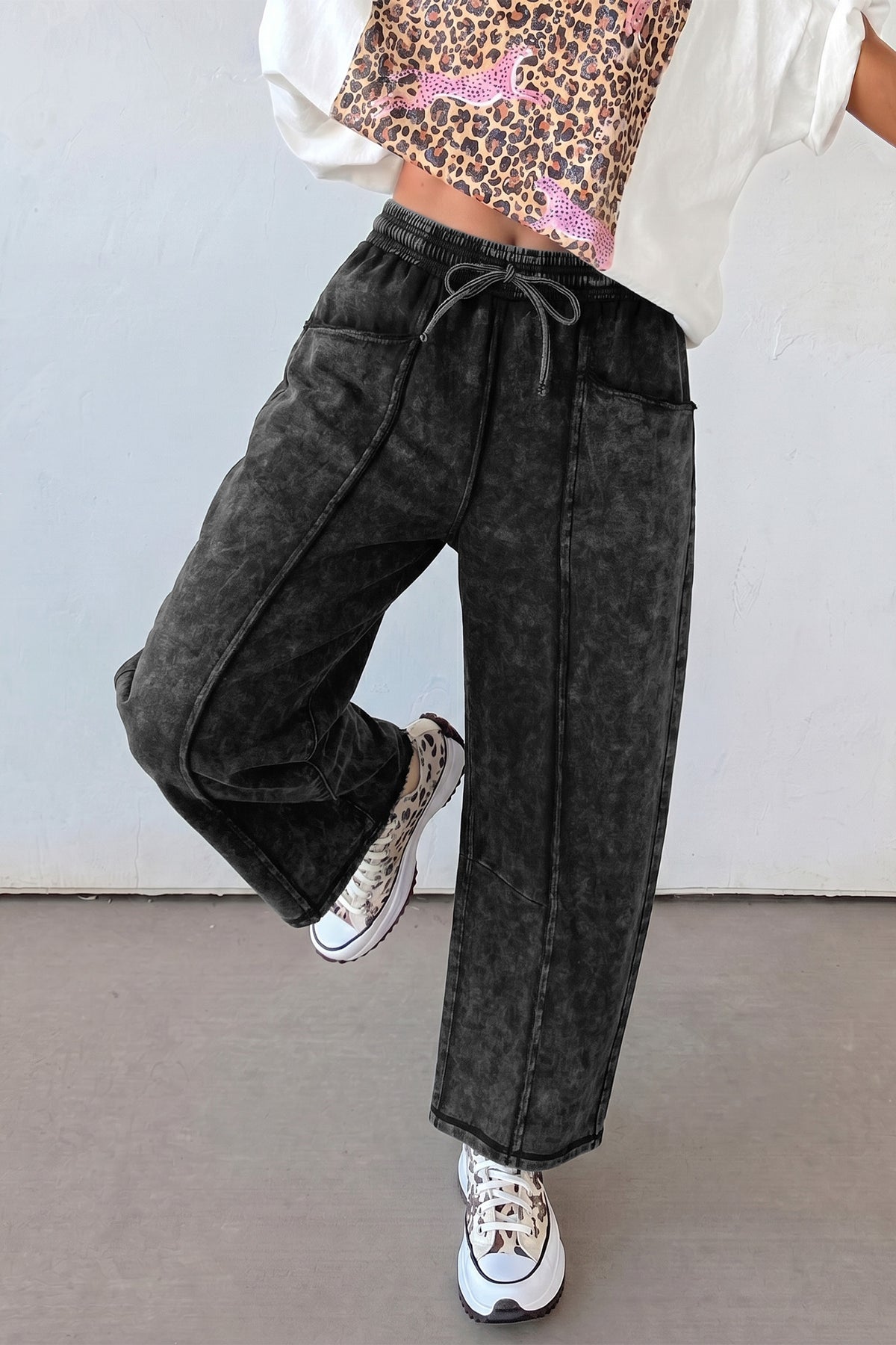 Black drawstring elastic waist barrel pants back view