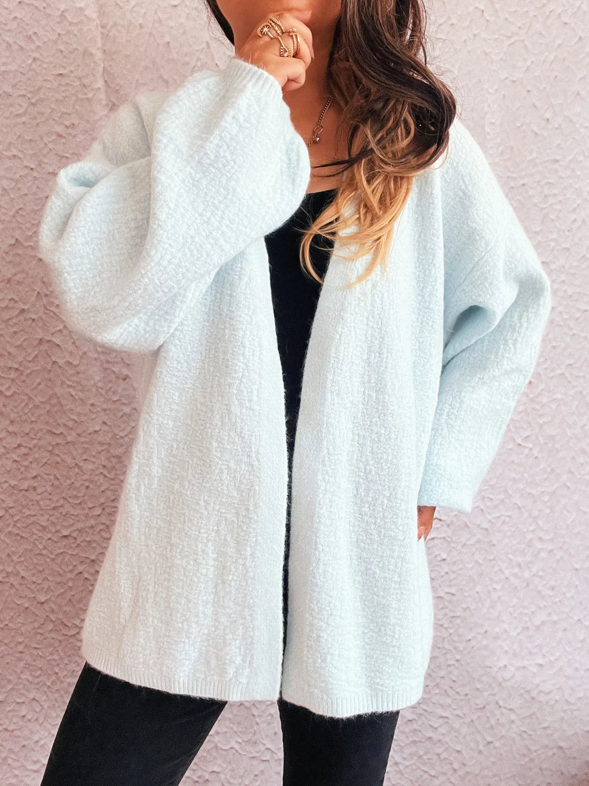 Open front cardigan styled with jeans
