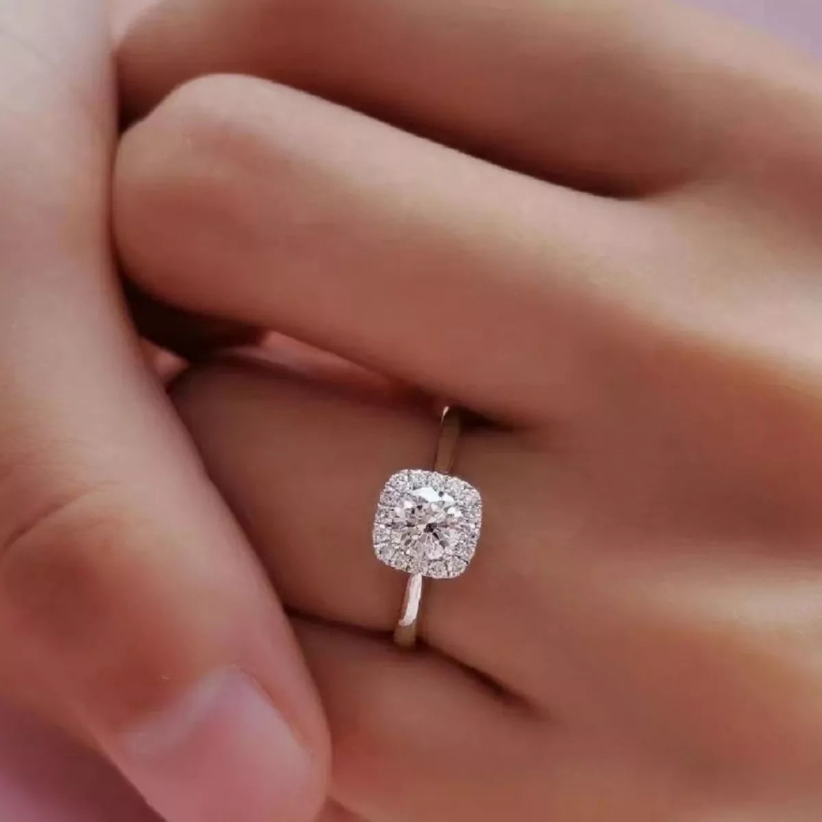 Square moissanite ring shown for size and scale
