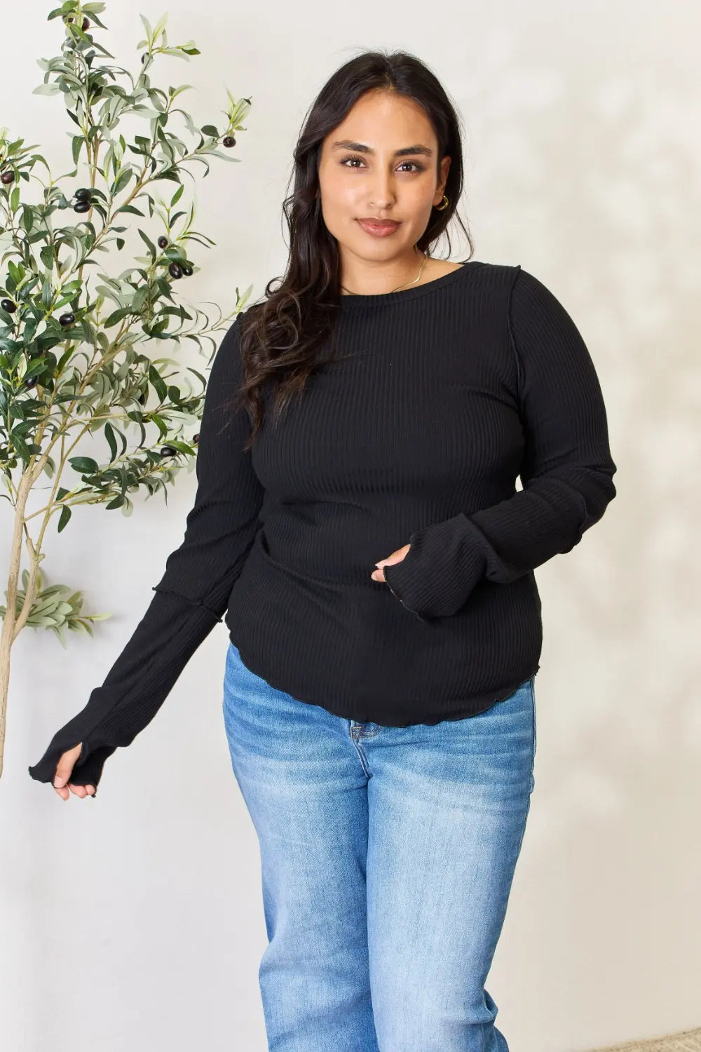 Front view of the black ribbed long sleeve top