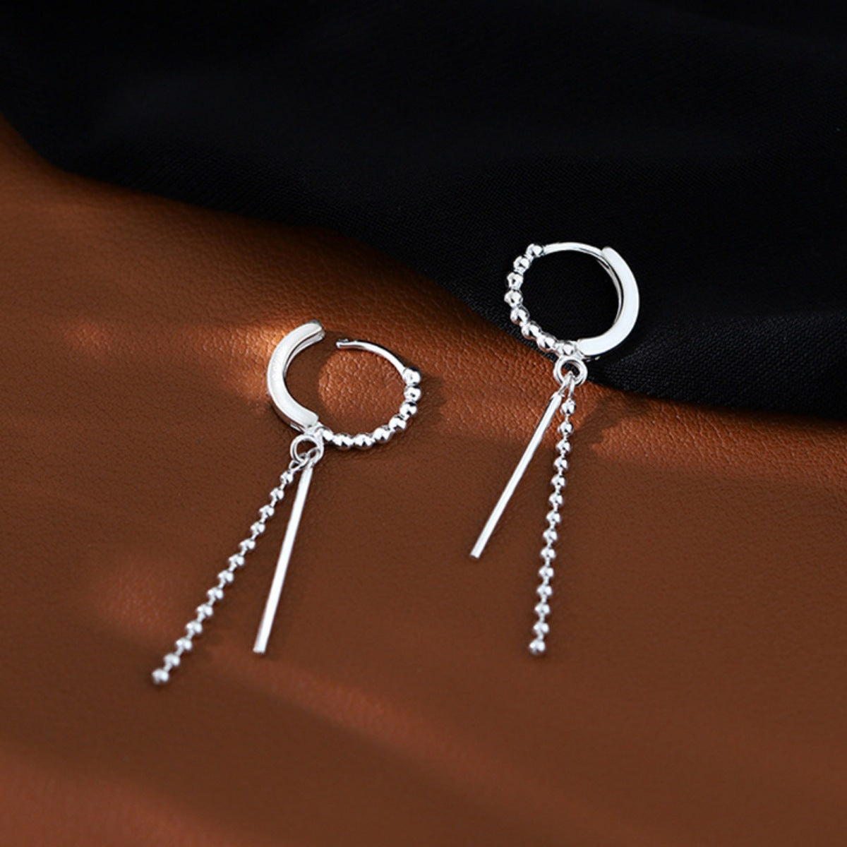 Silver hoop drop earring side profile