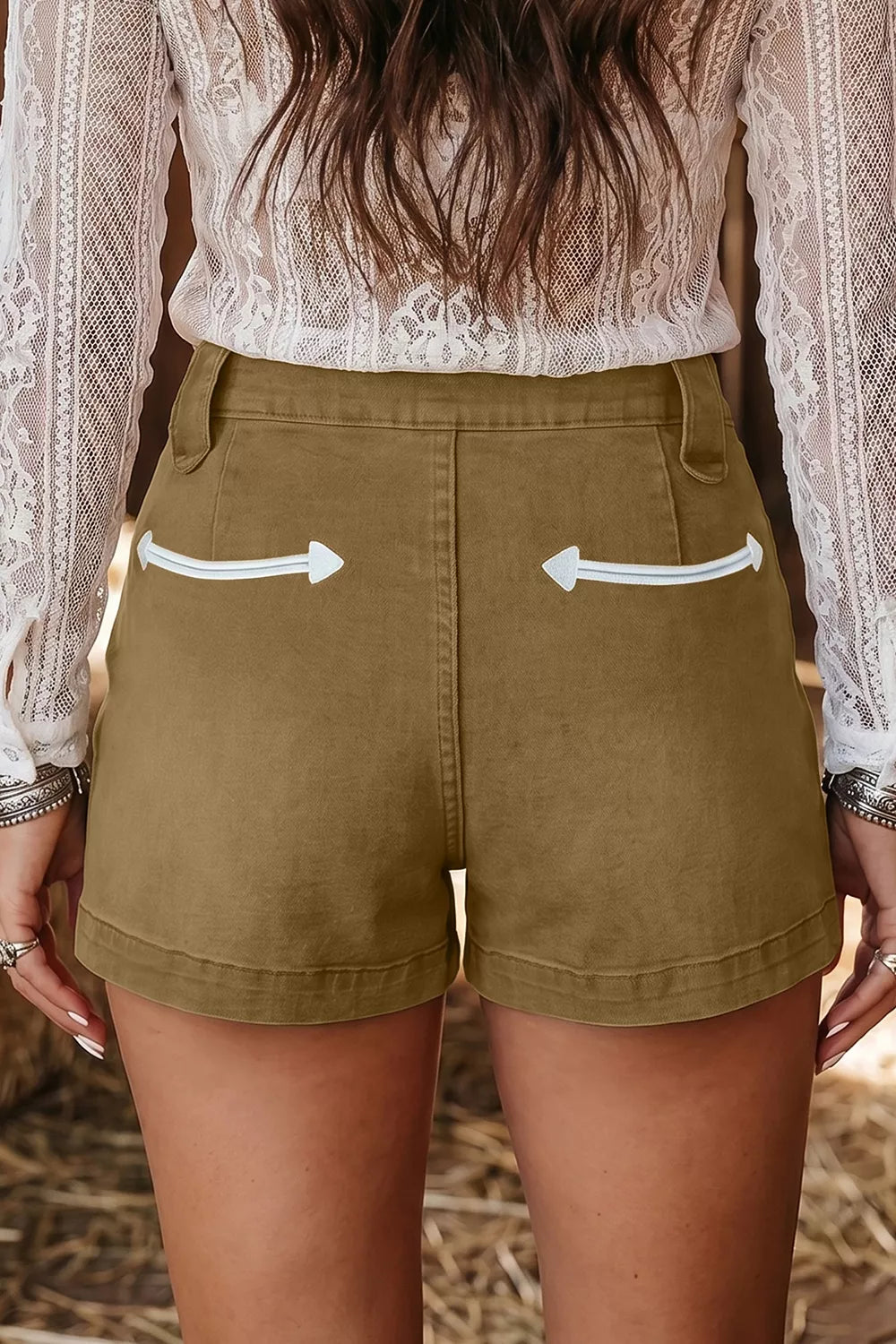 Contrast arrow embroidery detail on denim shorts pocket