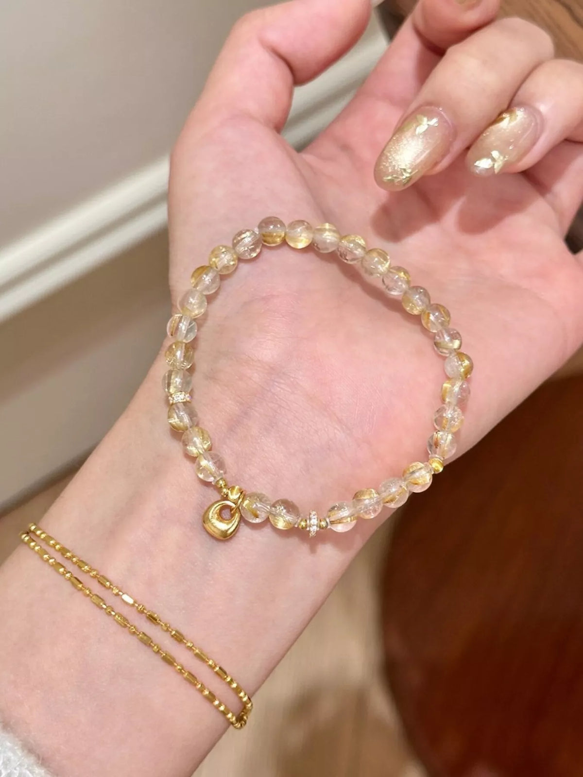 Gold tone beaded bracelet laid flat
