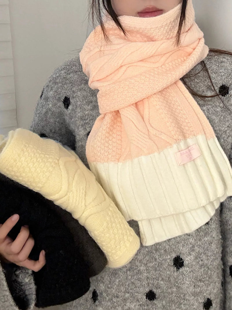 Two tone knitted warm scarf in soft pink at the neck