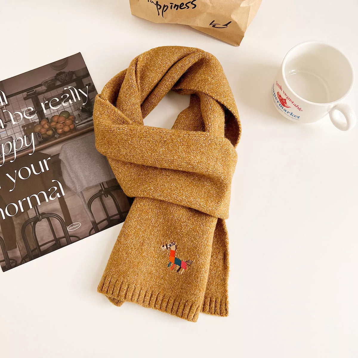 Embroidered scarf shown in a soft gentle shade