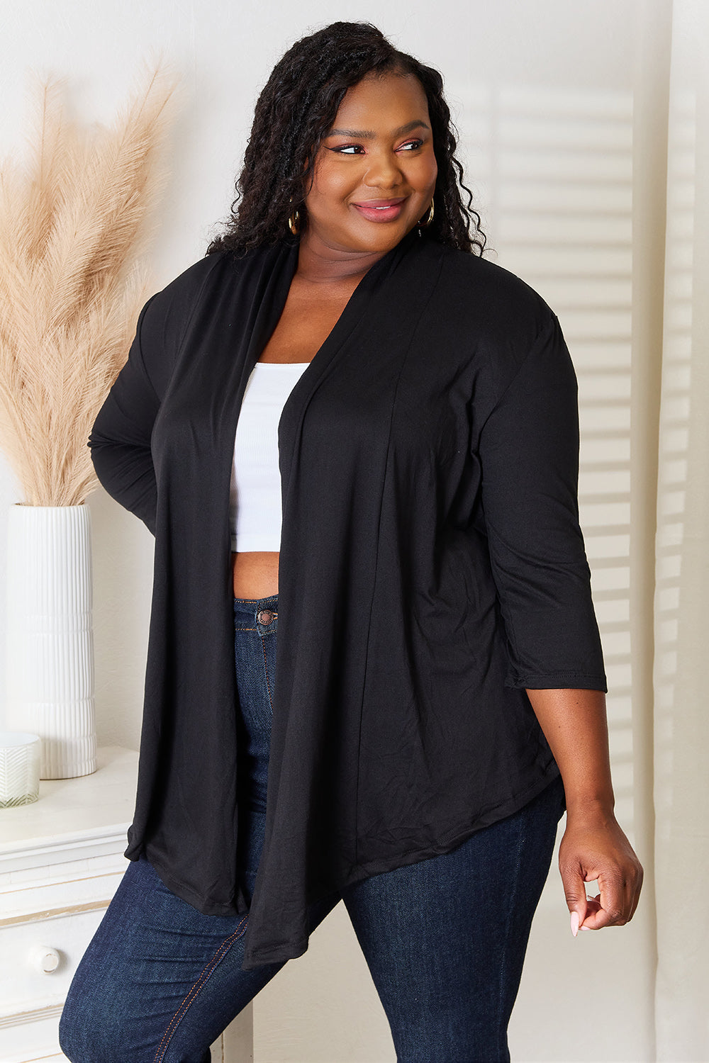 Side view of black open front cardigan