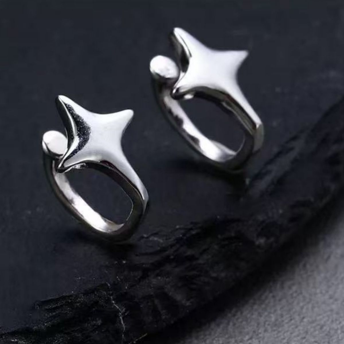 Sterling silver star cuff earring worn on a model ear