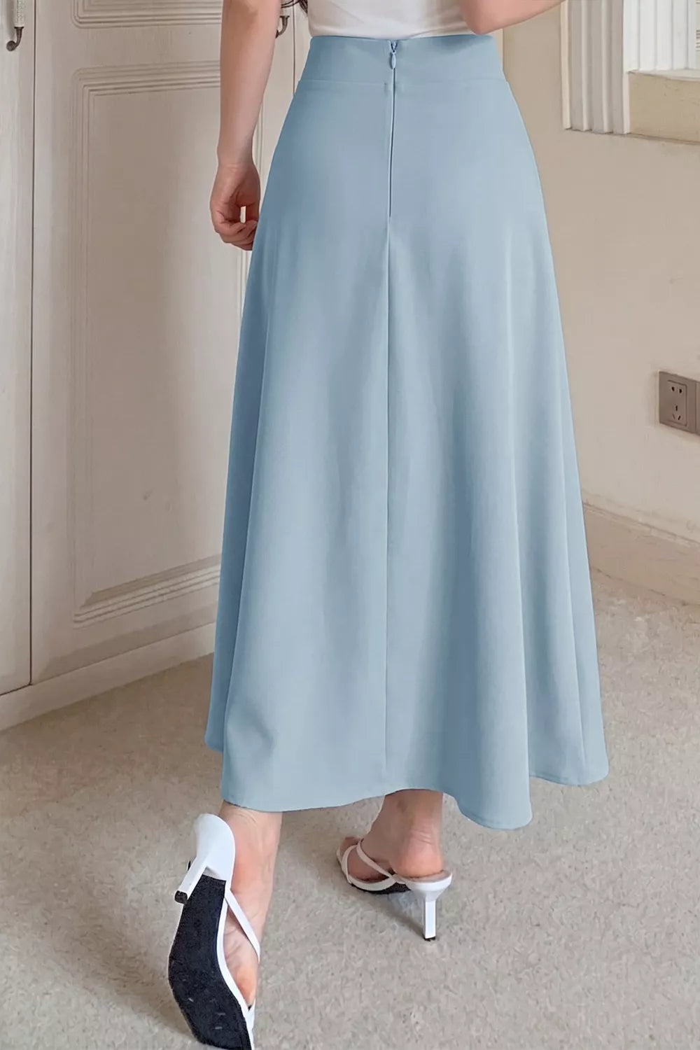 Light blue midi skirt waist and button detail