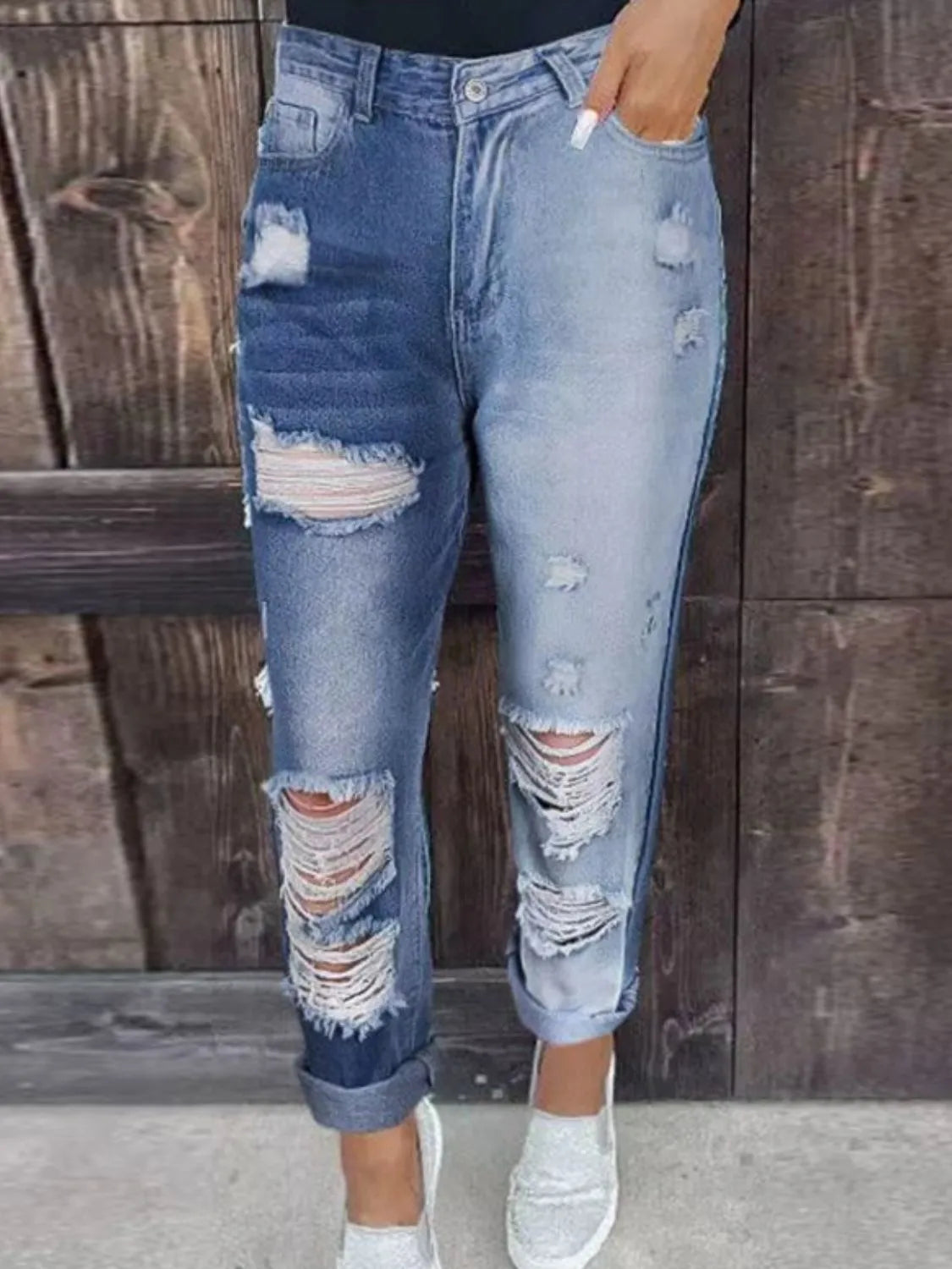 Distressed detail on light wash straight jeans