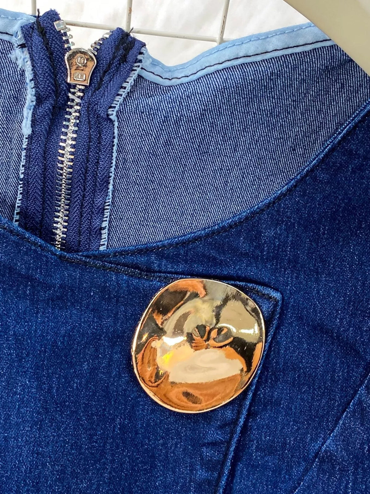 Denim vest and flare jeans overview