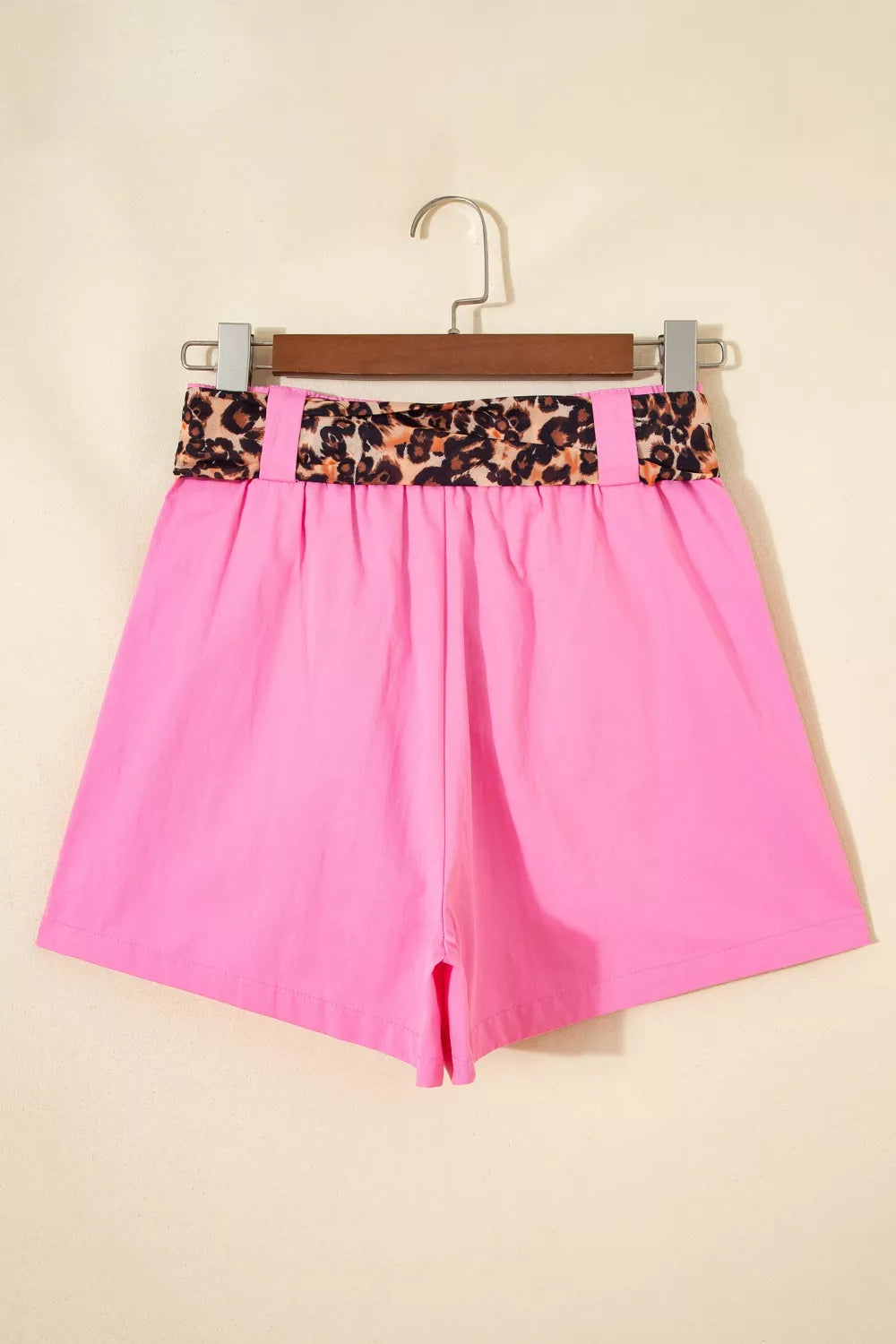 Fuchsia pink pleated wide leg shorts with leopard sash belt styled view