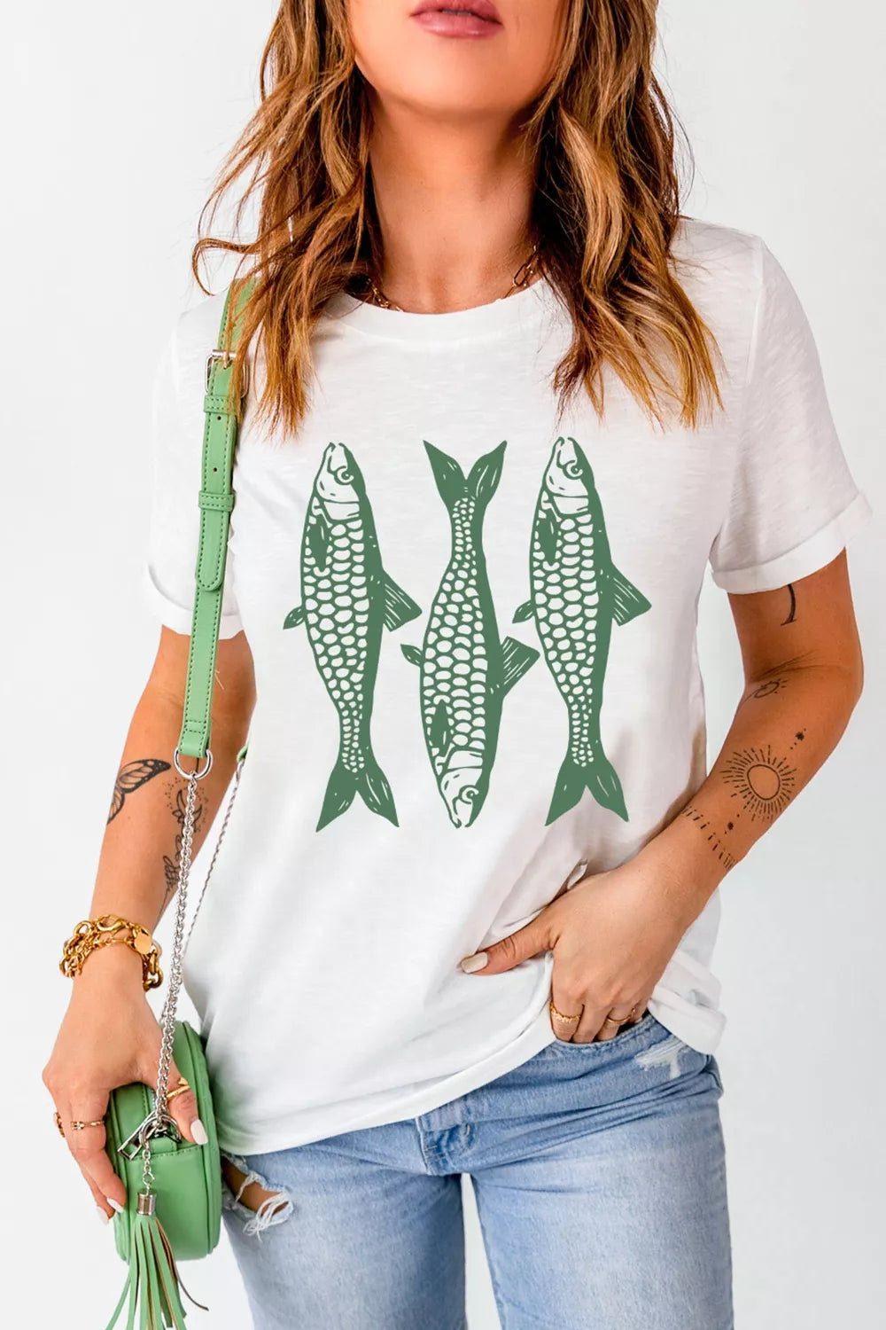 White fish graphic tee styled with jeans