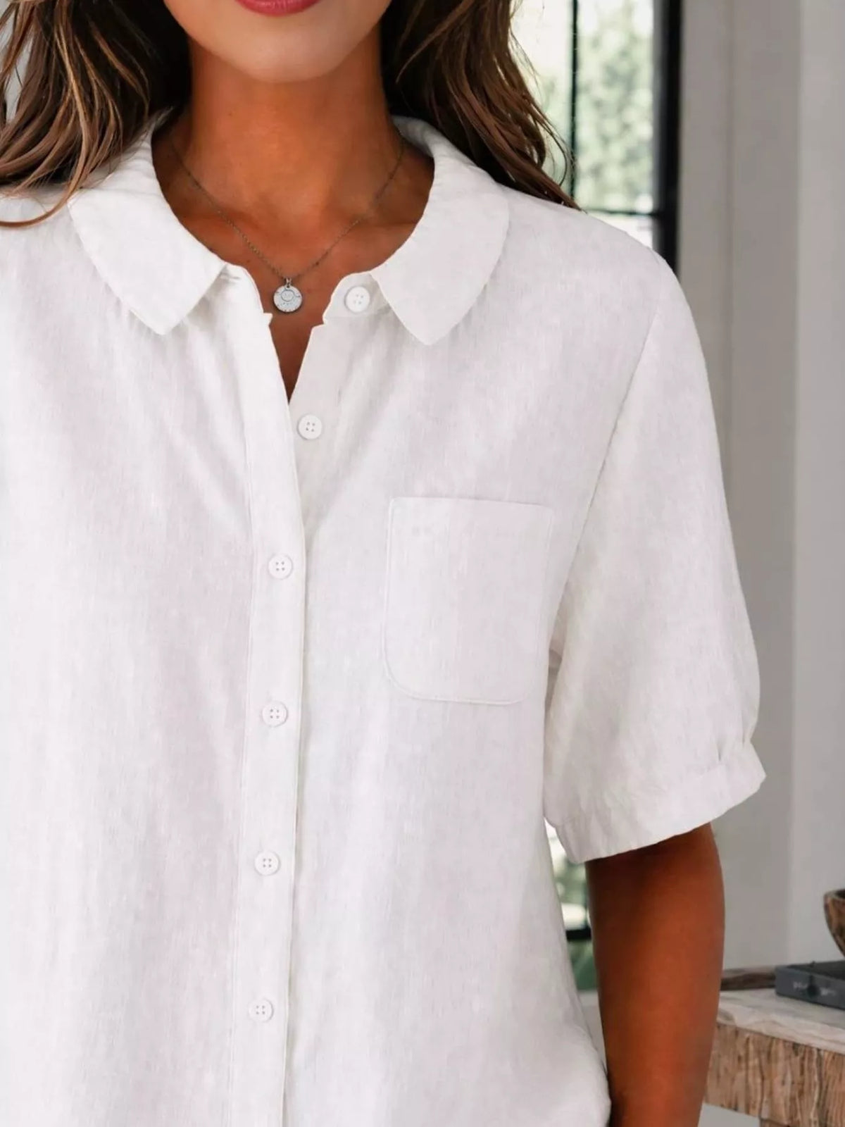 Womens shirt shown at a side angle