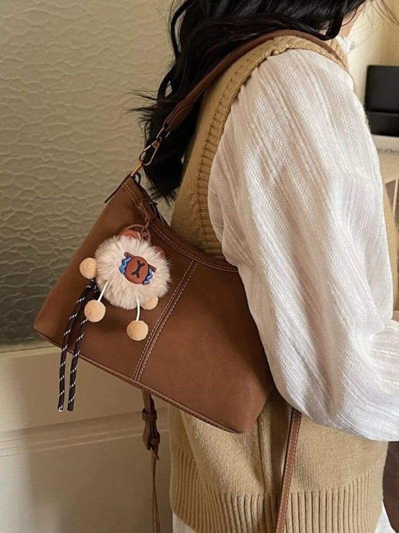 Caramel faux leather adjustable strap shoulder bag front view
