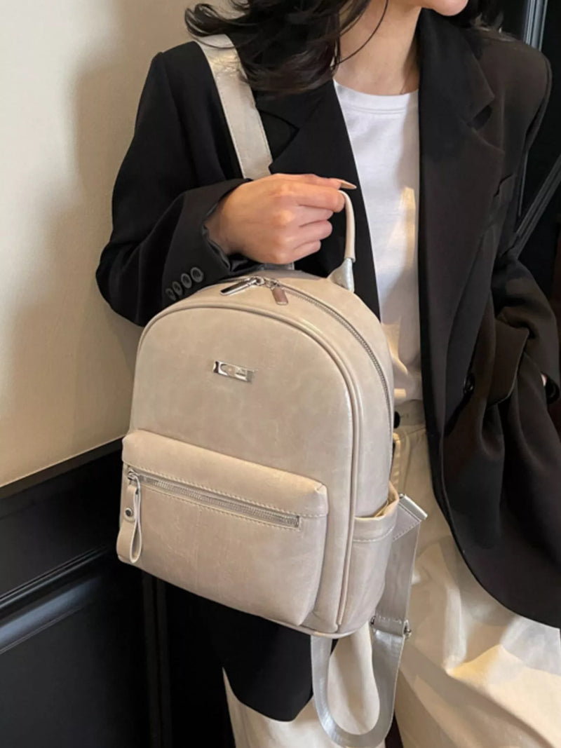 Off white PU leather mini backpack front view