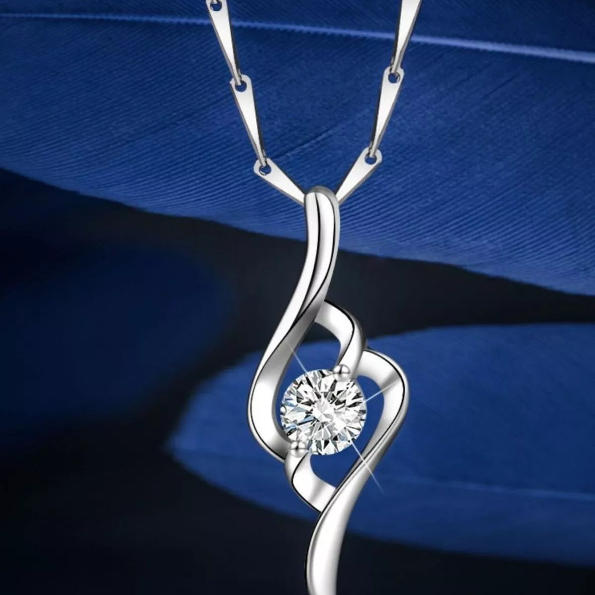 Moissanite pendant shown flat with the full chain