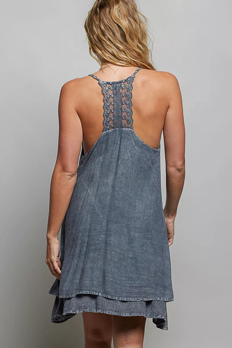 Embroidery detail on a charcoal mini dress