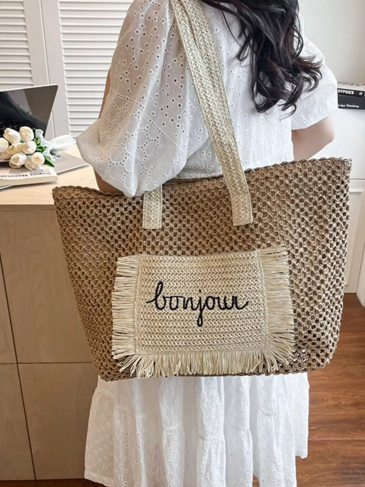 Interior of fringe straw shoulder bag