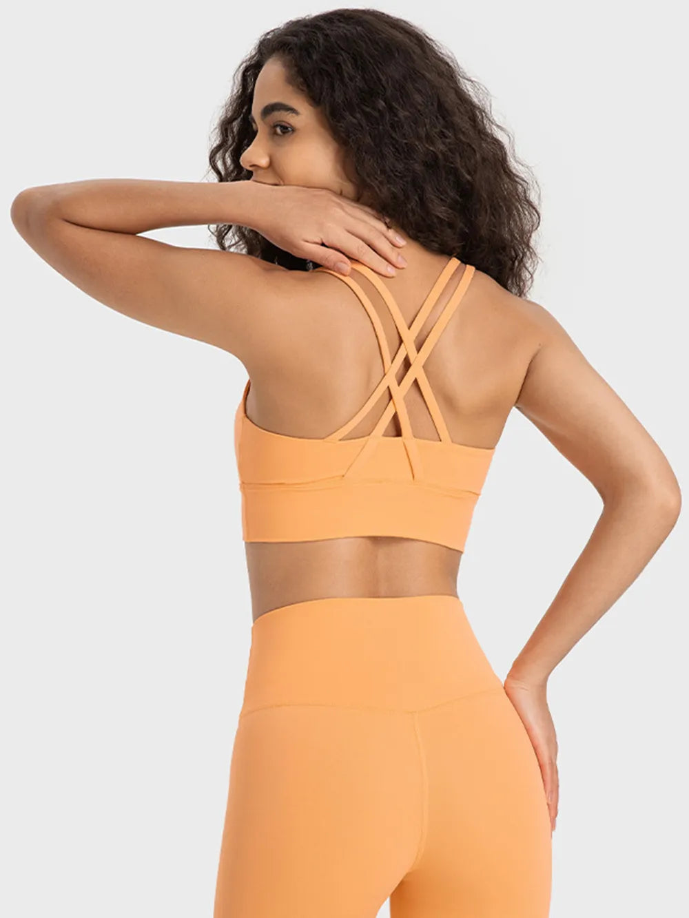 Crisscross scoop neck active tank pocket detail