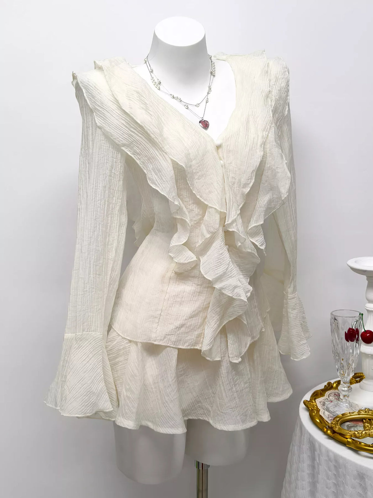 Ruffle trimmed blouse buttoned front detail