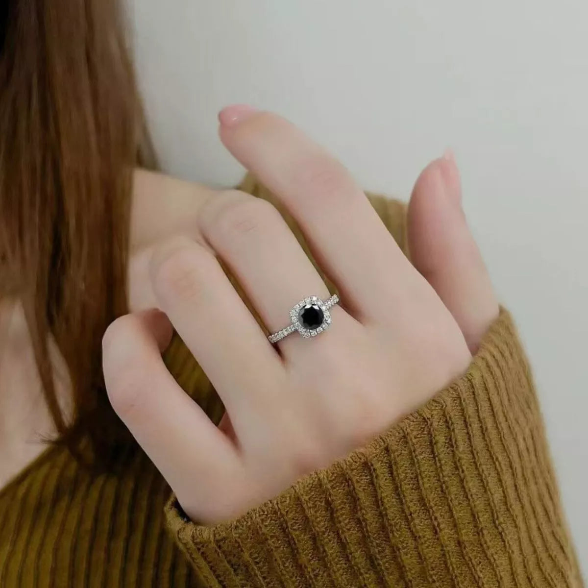 Moissanite ring shown at an angle to catch the light