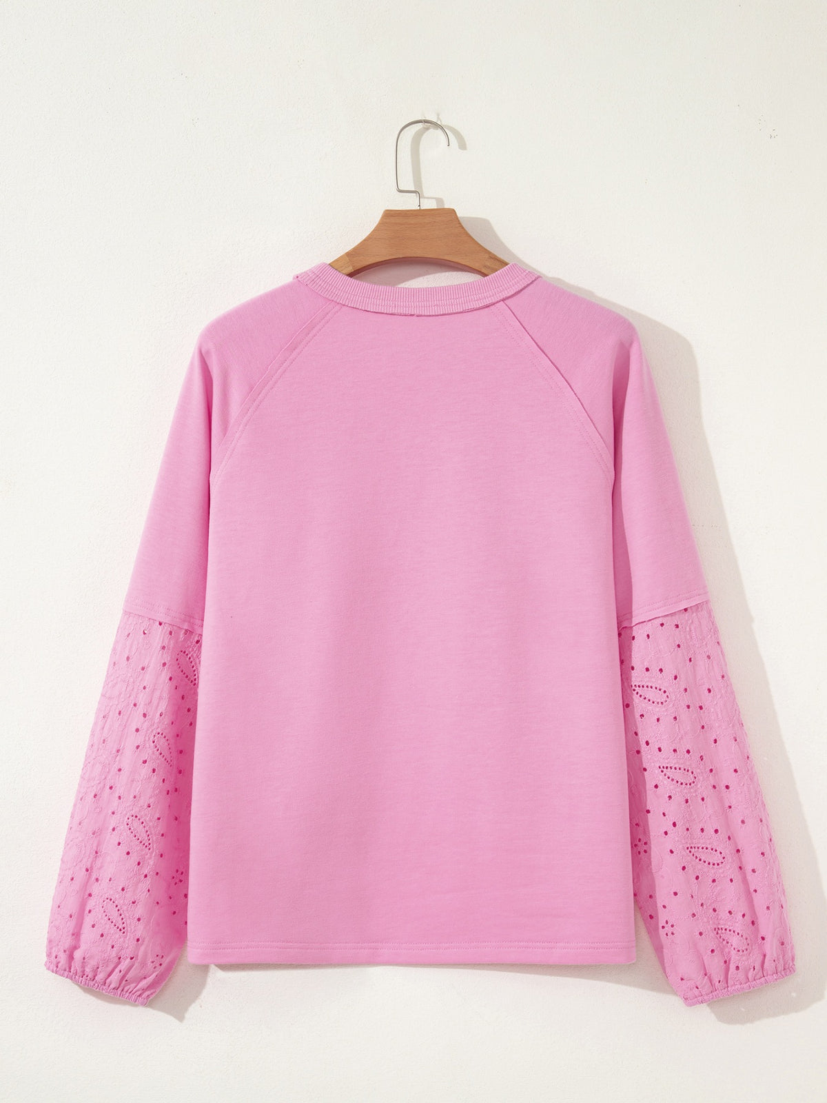 Close up of heart pattern on pink top